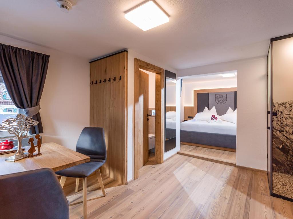 Rúm í herbergi á Dorfkaiser Appartements