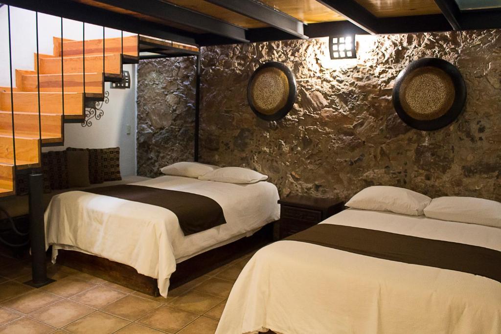 Postel nebo postele na pokoji v ubytování Hotel Suites Sofia
