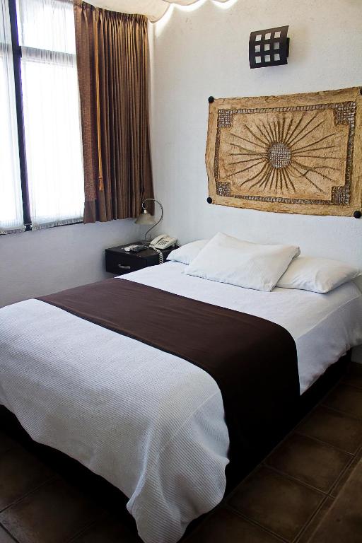 Postel nebo postele na pokoji v ubytování Hotel Suites Sofia