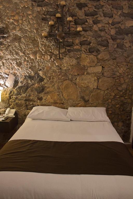 Postel nebo postele na pokoji v ubytování Hotel Suites Sofia