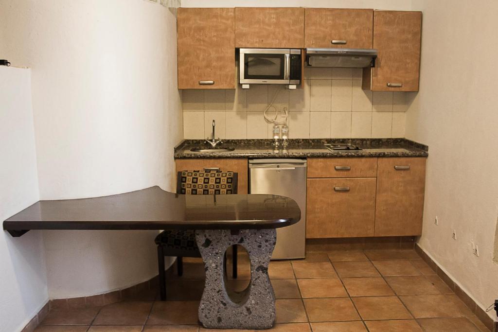 Kuchyň nebo kuchyňský kout v ubytování Hotel Suites Sofia