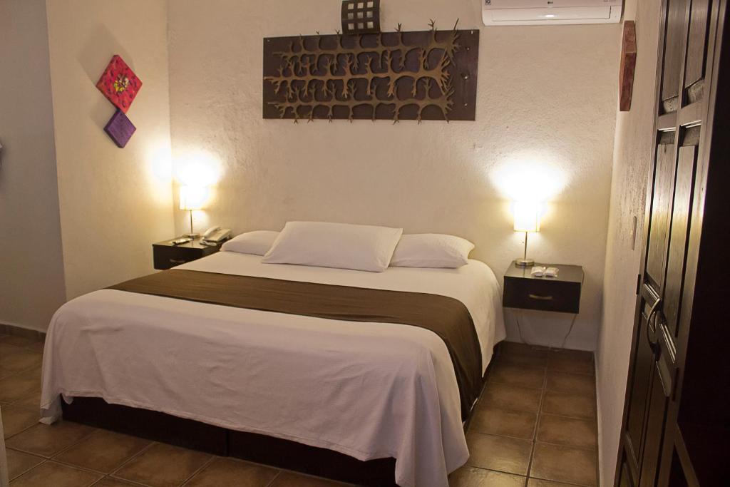 Postel nebo postele na pokoji v ubytování Hotel Suites Sofia