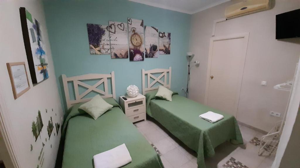 Cama o camas de una habitación en Pension Internacional