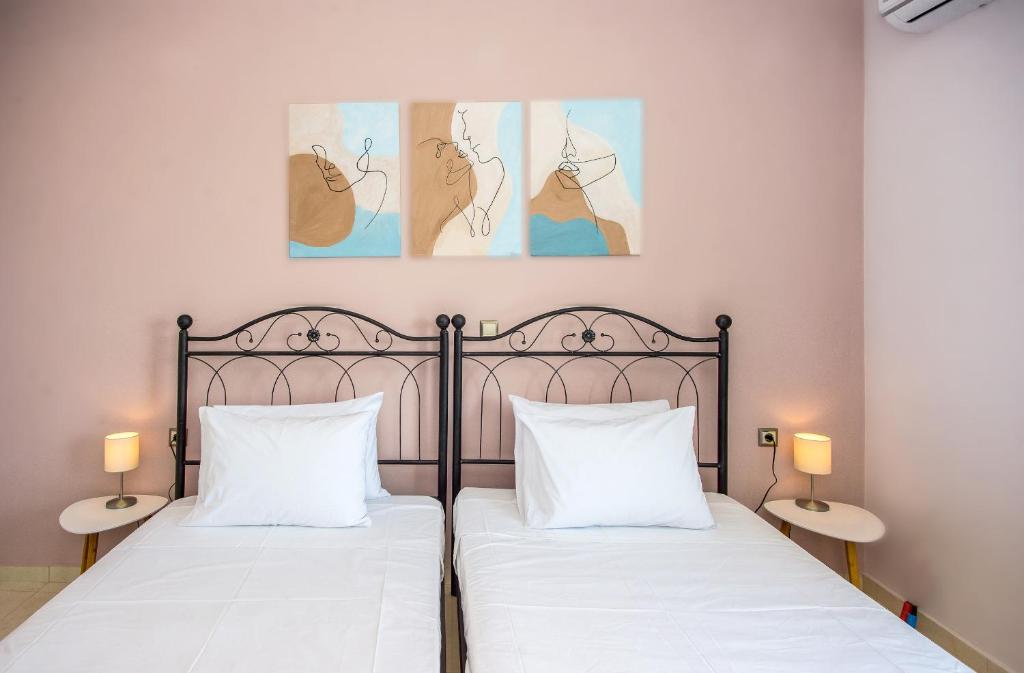 Postel nebo postele na pokoji v ubytování Aella Apartment