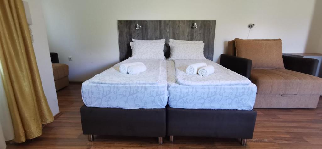 Postel nebo postele na pokoji v ubytování Apartments Banjica