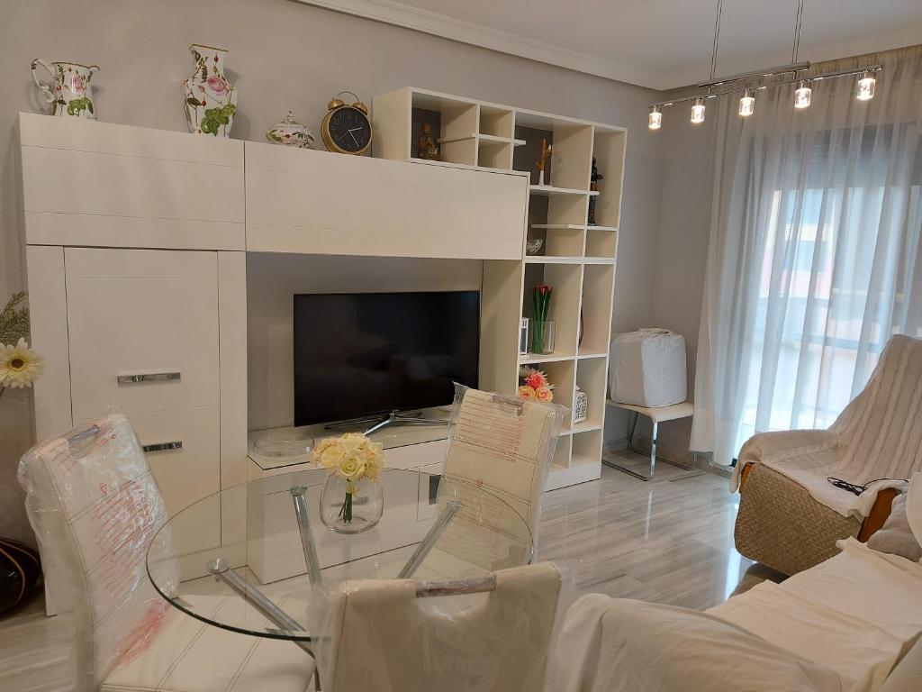 A television and/or entertainment centre at Love Rent4 Málaga Bajondillo Playa II