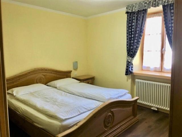 Postel nebo postele na pokoji v ubytování Appartamenti Sissi