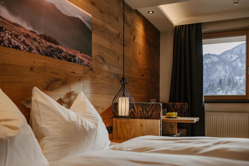 Postel nebo postele na pokoji v ubytování loisi's Boutiquehotel