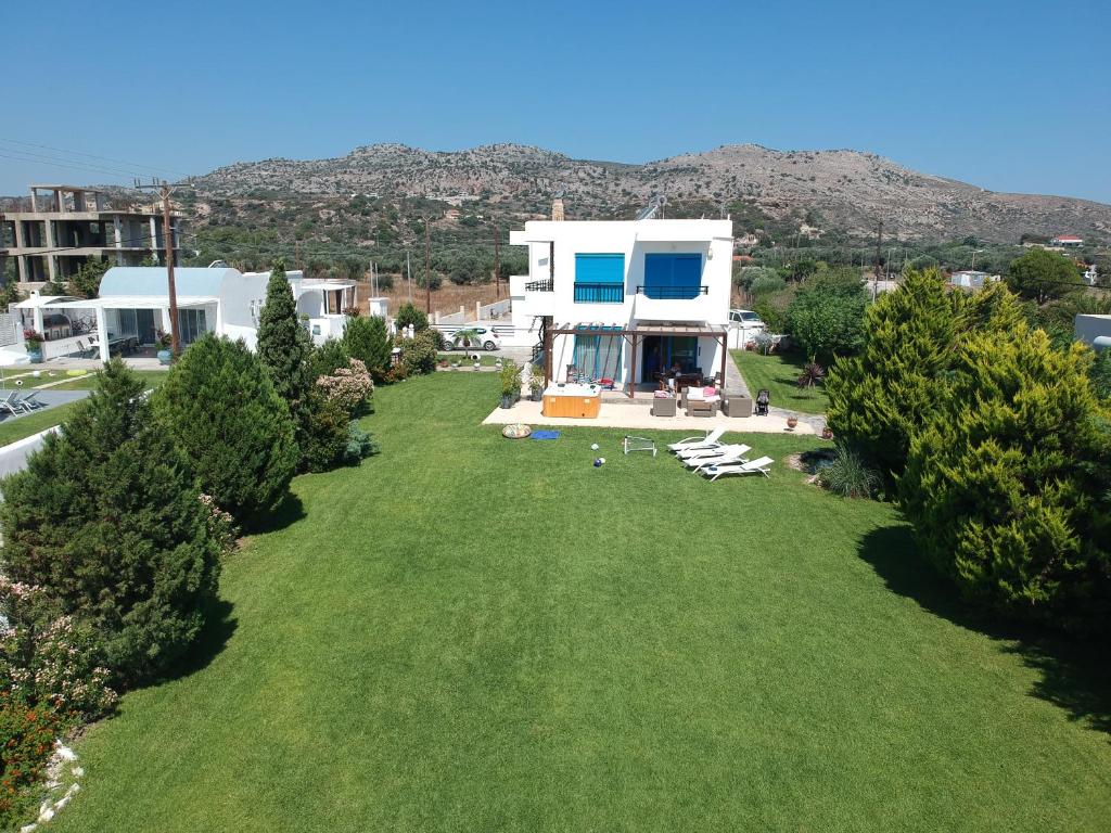 an aerial view of a house with a large yard at Seascape Villa in Afantou