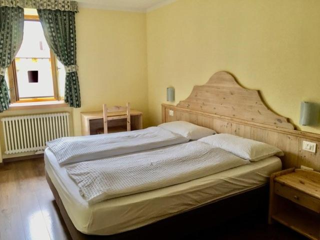 Postel nebo postele na pokoji v ubytování Appartamenti Sissi