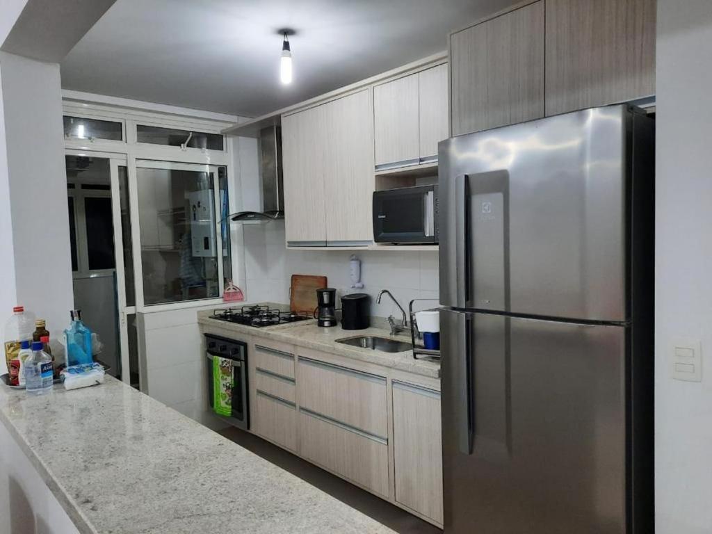  Apartamento de Frente ao Mar em Bertioga - Comodidade e Lazer