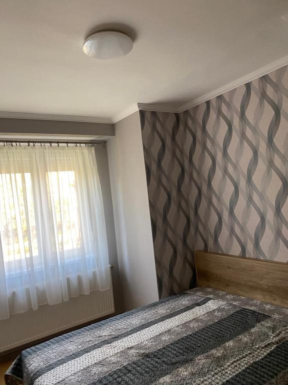 Postel nebo postele na pokoji v ubytování Platán Apartman
