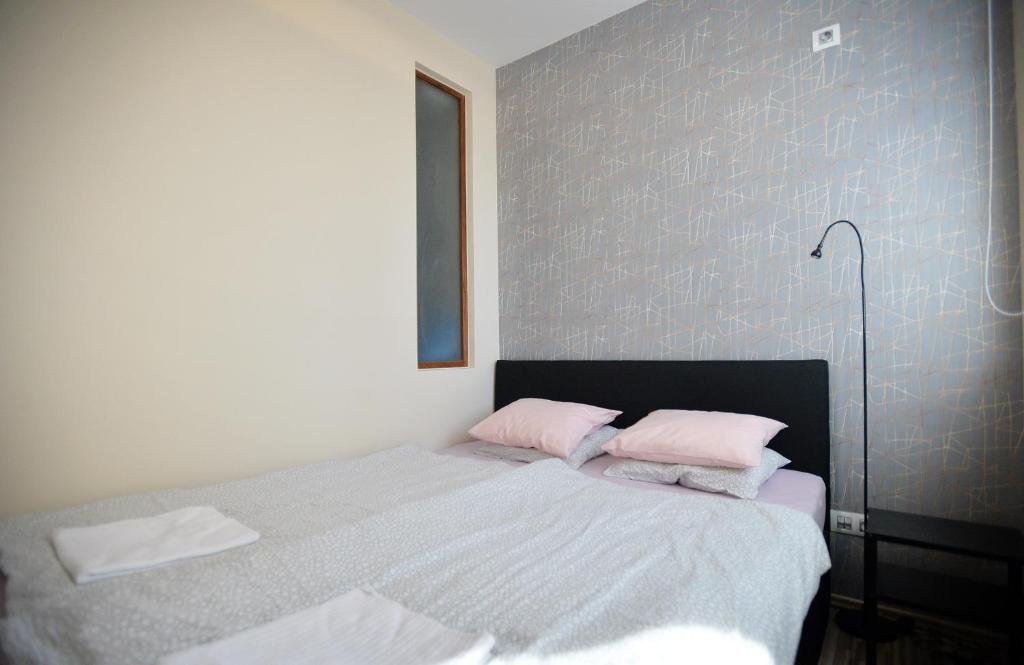 Posteľ alebo postele v izbe v ubytovaní Family Deluxe Apartments