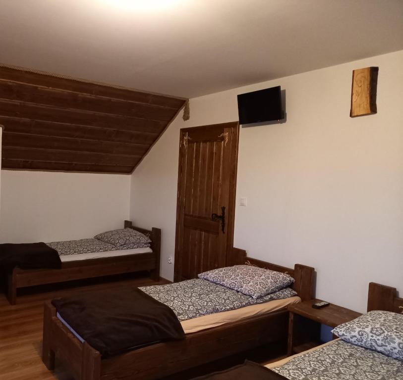 Posteľ alebo postele v izbe v ubytovaní Zagroda na Borach