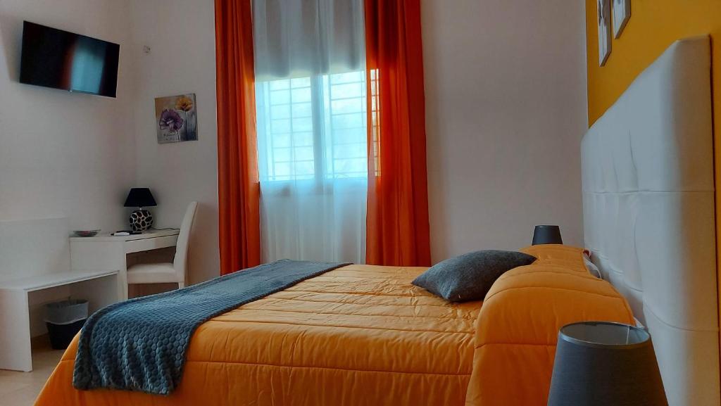 A bed or beds in a room at La Suite Di Segesta