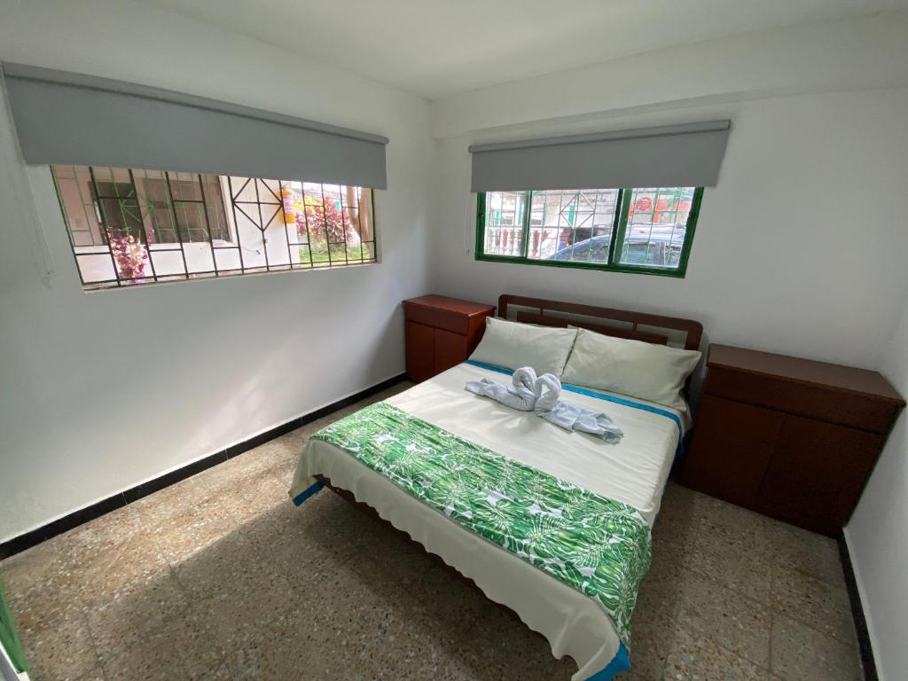 Postel nebo postele na pokoji v ubytování Hotel Maratea Melgar