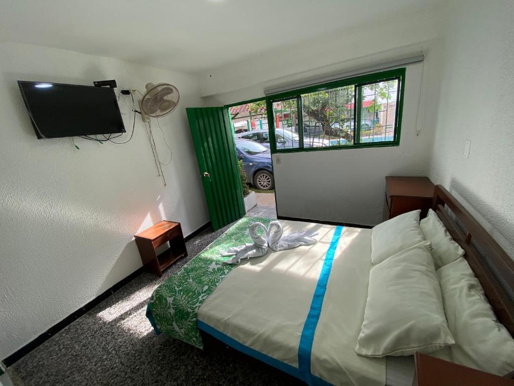 Postel nebo postele na pokoji v ubytování Hotel Maratea Melgar