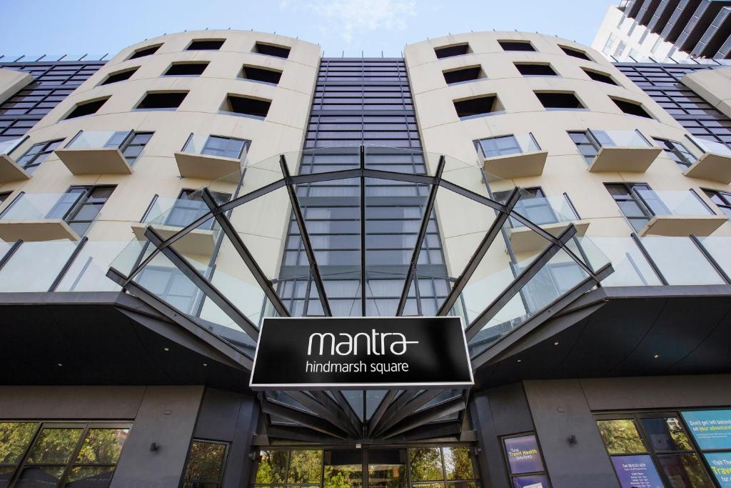 a sign in front of a building at Mantra Hindmarsh Square in Adelaide