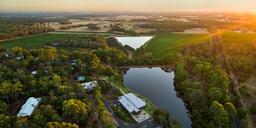 an aerial view of a lake and trees at Eight Willows Retreat in Margaret River Town