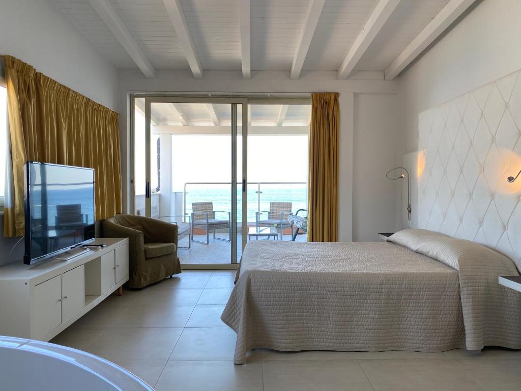 Postel nebo postele na pokoji v ubytování IG-Tysandros Hotel Apartments