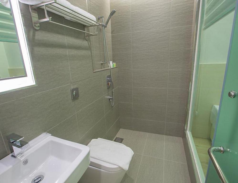 Koupelna v ubytování Minimalist Hotel