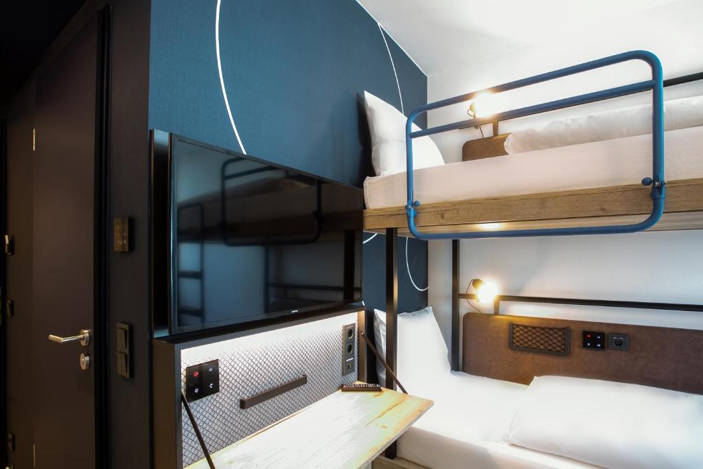 Postel nebo postele na pokoji v ubytování H2 Hotel Budapest