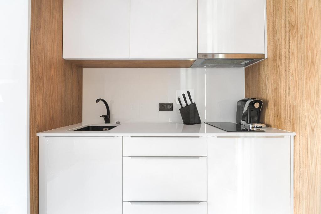 Kuchyňa alebo kuchynka v ubytovaní City Apartments - Młyńska 49