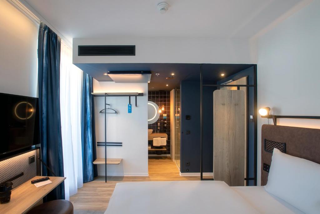 Postel nebo postele na pokoji v ubytování H2 Hotel Budapest