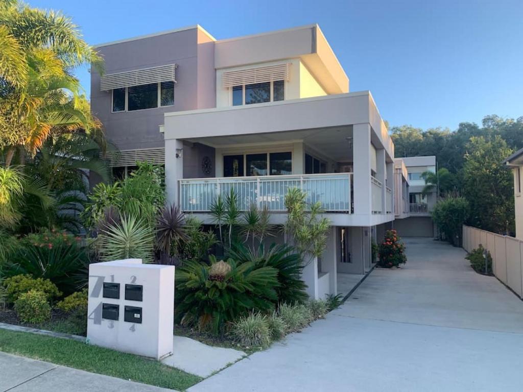 a house with a walkway in front of it at Riverview Apartment in Yamba