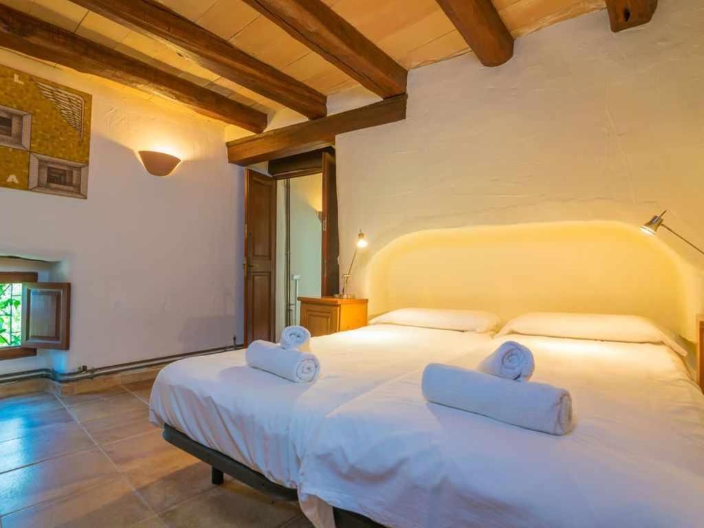 Postel nebo postele na pokoji v ubytování Finca Son Xona Alcina Vacation