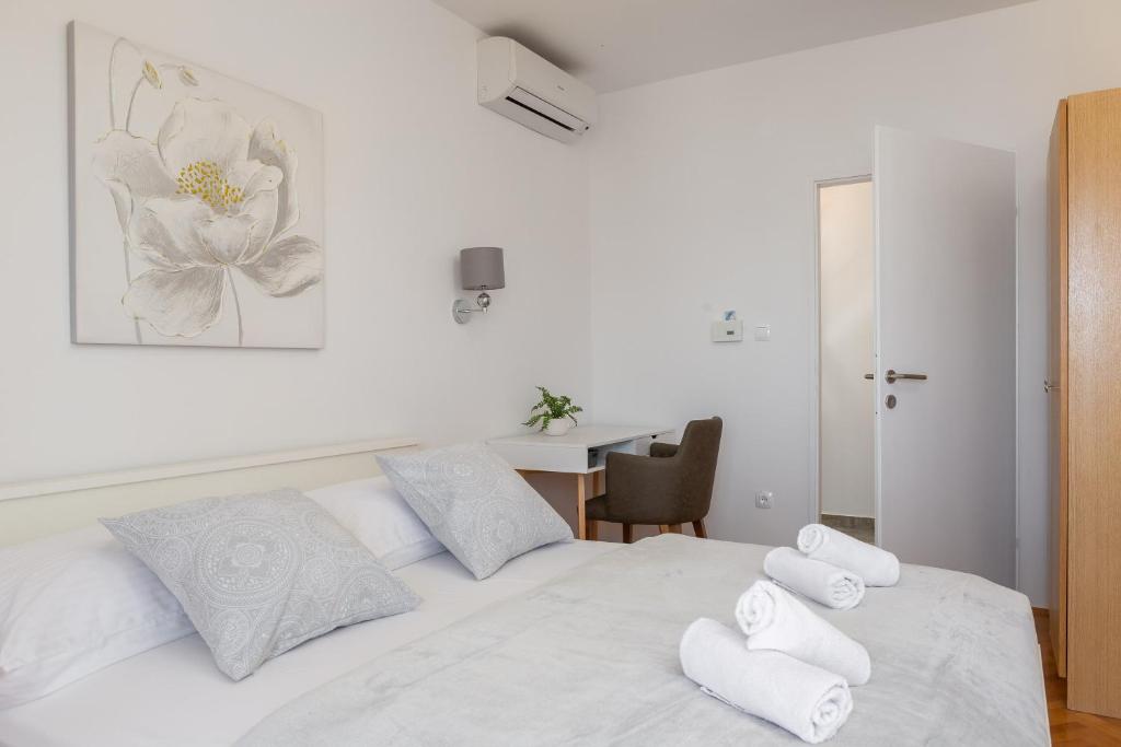 Posteľ alebo postele v izbe v ubytovaní Beach Apartments Croatia