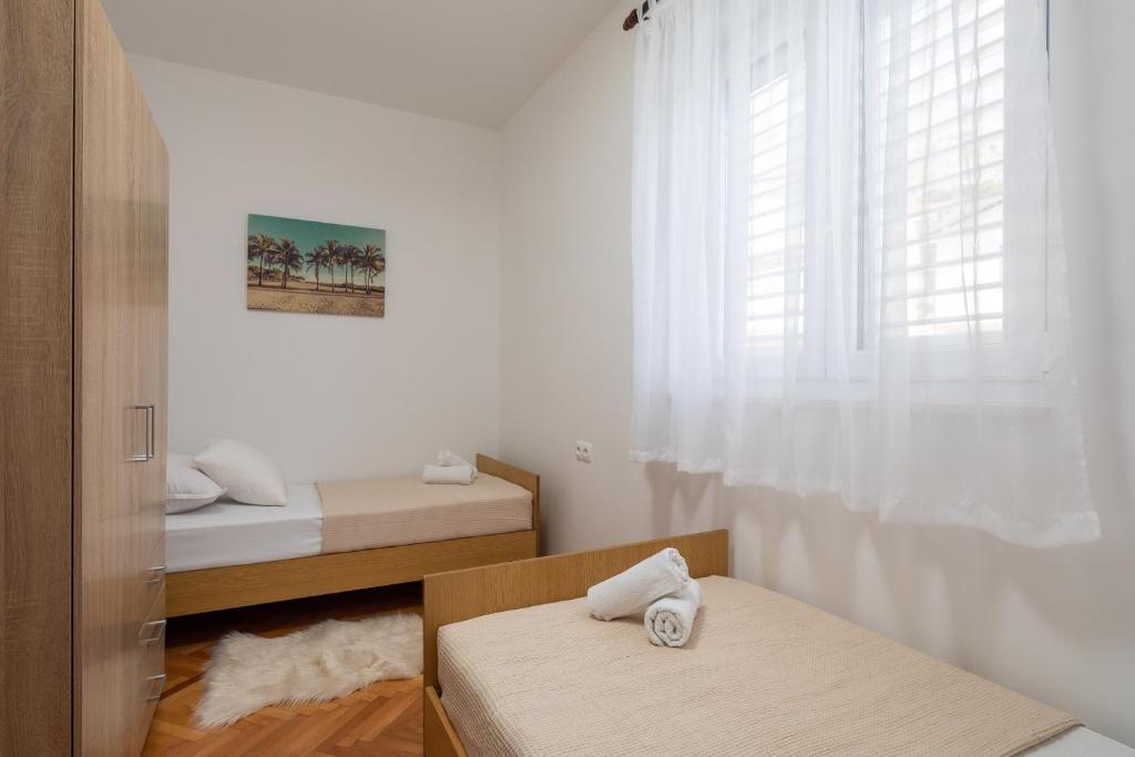 Posteľ alebo postele v izbe v ubytovaní Beach Apartments Croatia