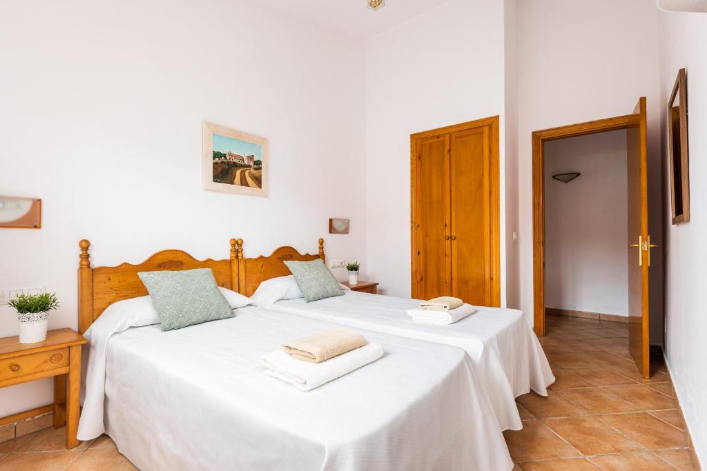 Postel nebo postele na pokoji v ubytování Villa Nurimar