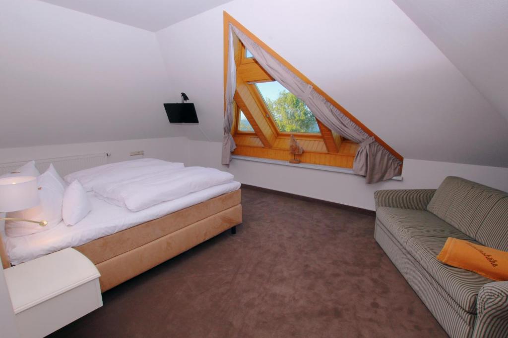 Postel nebo postele na pokoji v ubytování Hotel Wilhelmshöhe