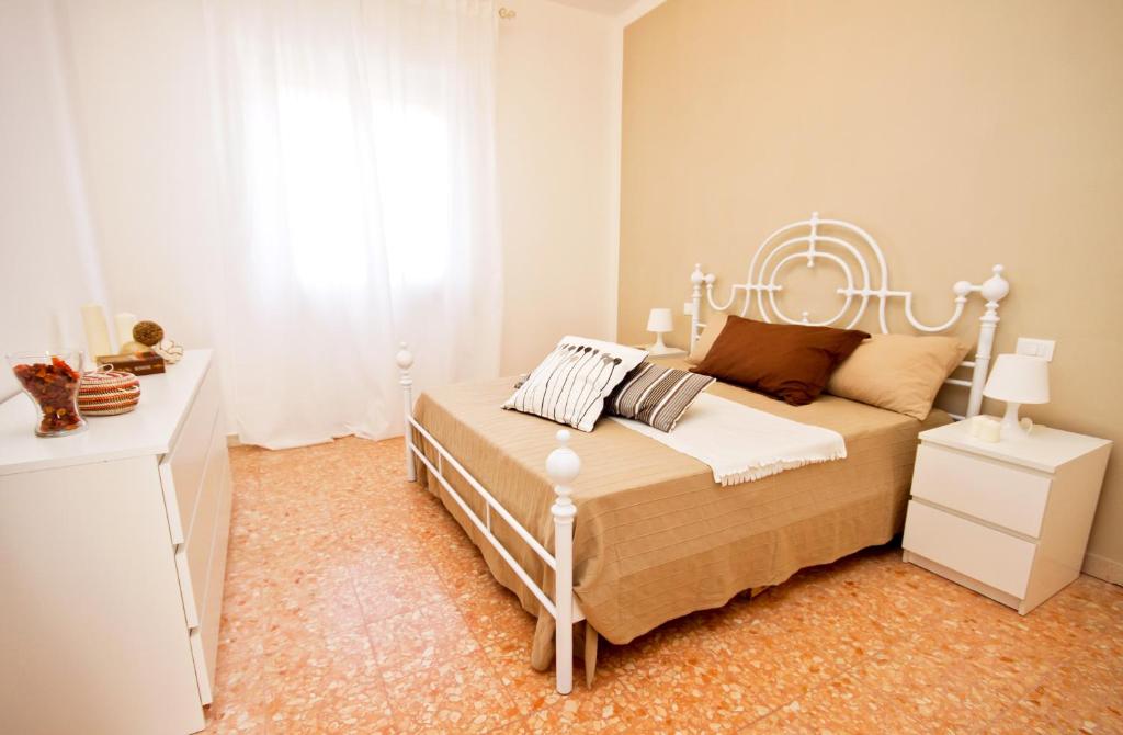 Posteľ alebo postele v izbe v ubytovaní Apt luminoso, spazioso con Aria condiz e bici