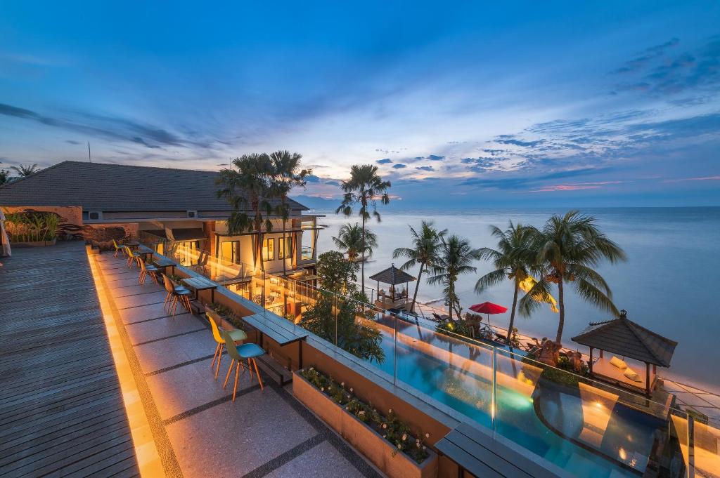 an aerial view of a hotel with a view of the ocean at Padmasari Resort Lovina in Lovina