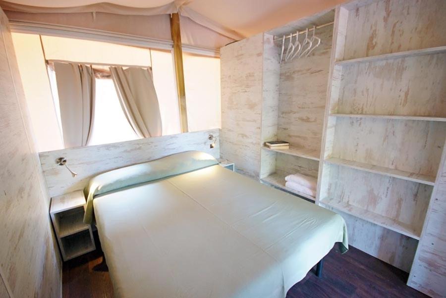 Postel nebo postele na pokoji v ubytování Camping Village Scaglieri