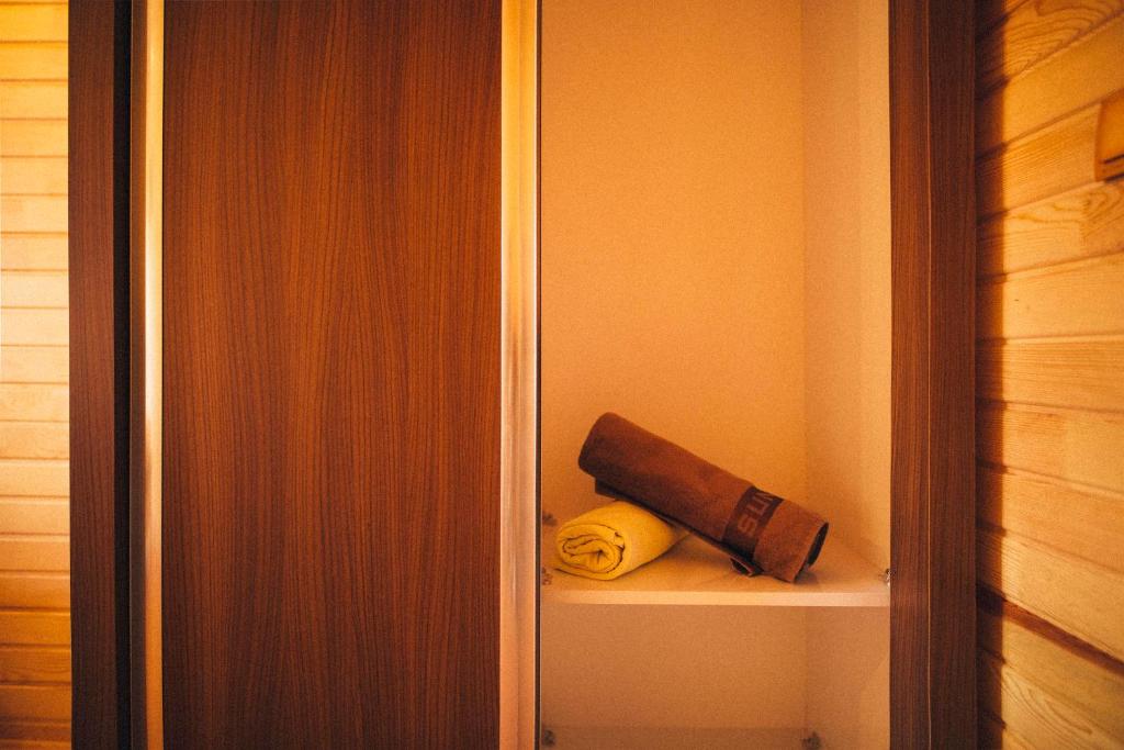 a closet with a book and a towel on a shelf at 7 Green Adrasan in Adrasan