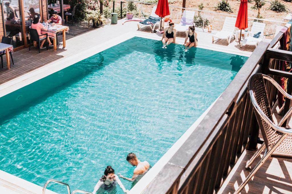 a group of people in a swimming pool at 7 Green Adrasan in Adrasan