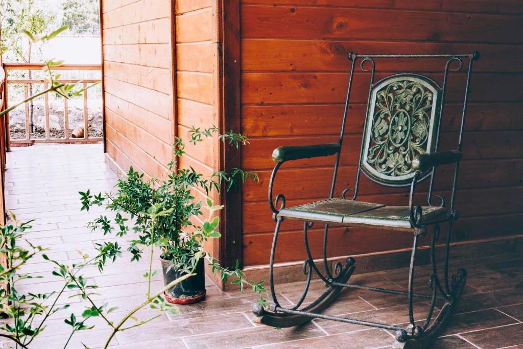 a metal chair sitting on a porch at 7 Green Adrasan in Adrasan