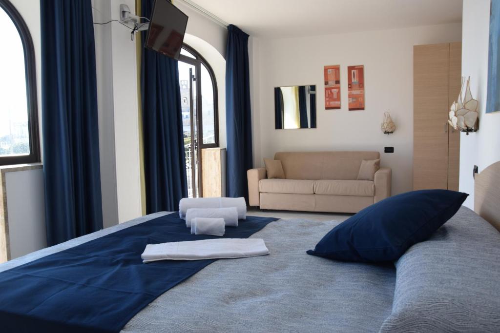 Postel nebo postele na pokoji v ubytování Hotel Profumo Di Mare
