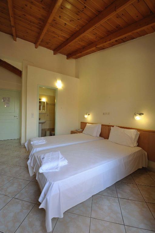 Postel nebo postele na pokoji v ubytování Kentrikon Hotel & Spa