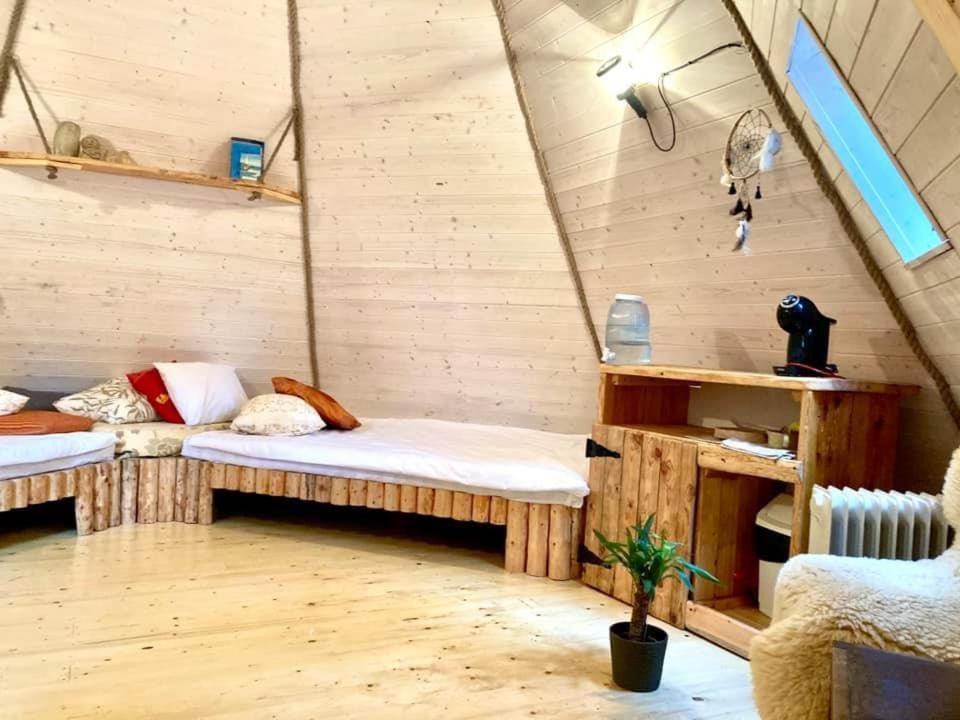 a room with two beds in a tent at Riksi püstkoda in Hiiumaa