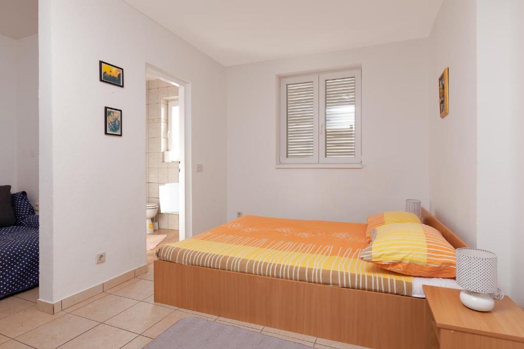 Postel nebo postele na pokoji v ubytování Apartment Kathy