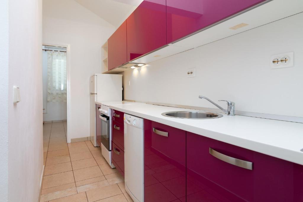 Kuchyň nebo kuchyňský kout v ubytování Apartment Kathy