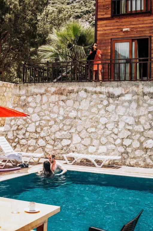 two people in the swimming pool at a resort at 7 Green Adrasan in Adrasan