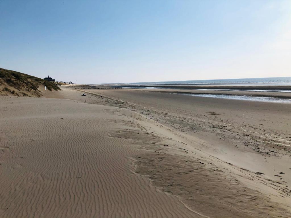 an empty beach with footprints in the sand at Mobil-home 4 personnes 400m de la mer in Berck-sur-Mer