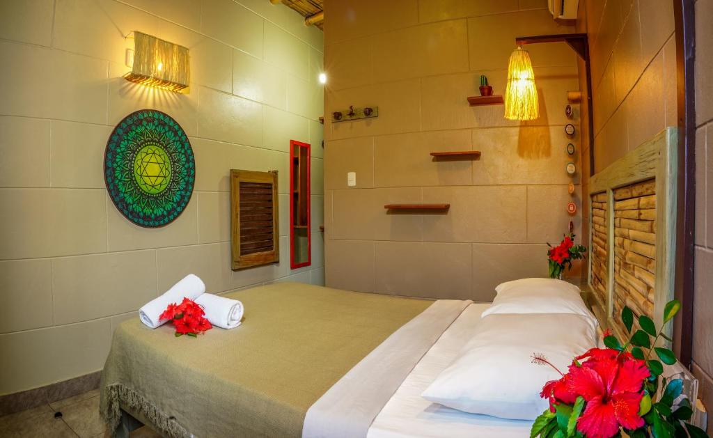 Postel nebo postele na pokoji v ubytování Hotel Kundalini