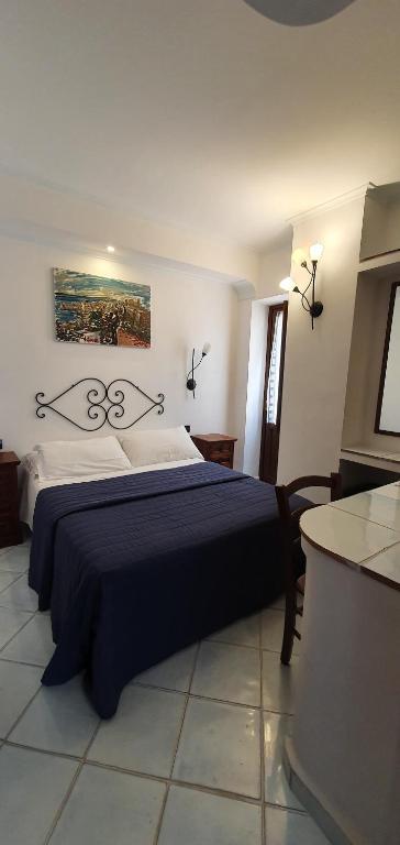 Postel nebo postele na pokoji v ubytování Hotel Corallo Sperlonga
