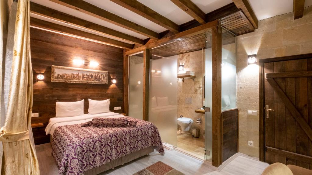 Postel nebo postele na pokoji v ubytování In Stone House